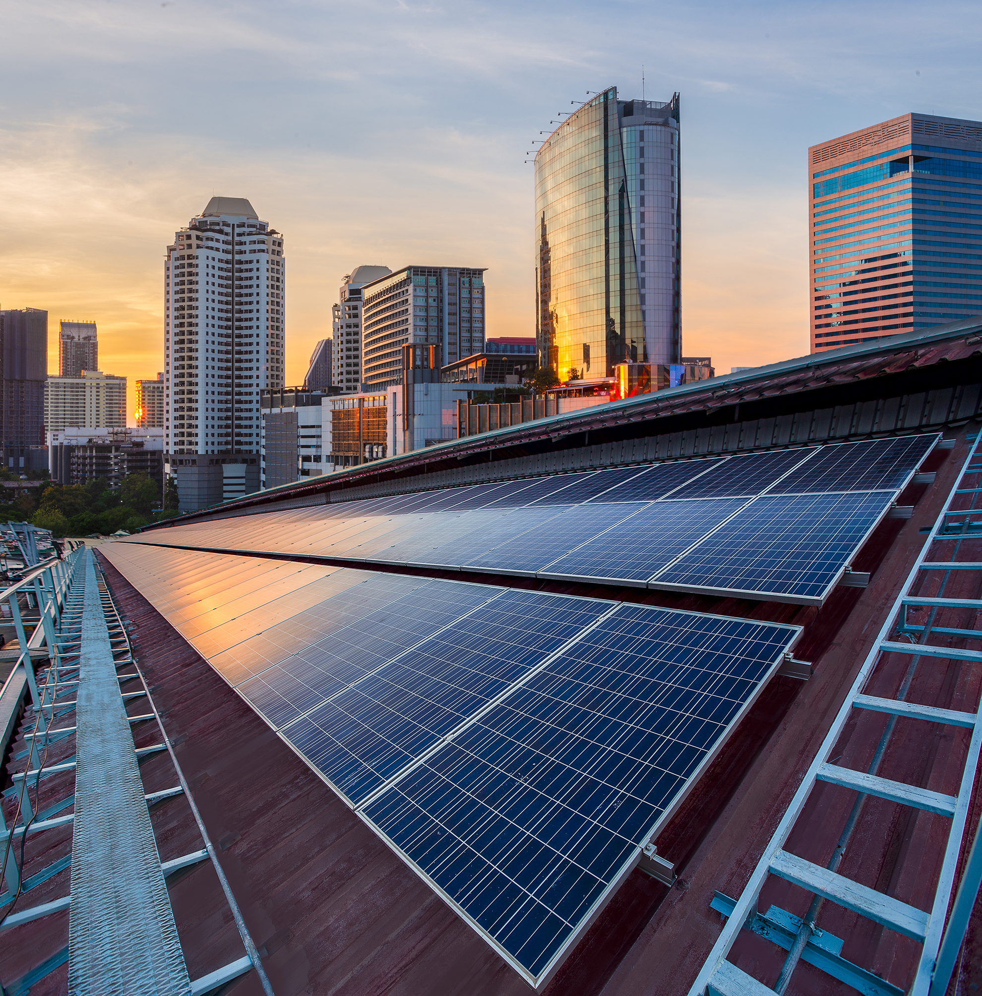 Solar Panel Photovoltaic installation on a Roof of factory, sunny blue sky background, alternative electricity source - Sustainable Resources Concept.